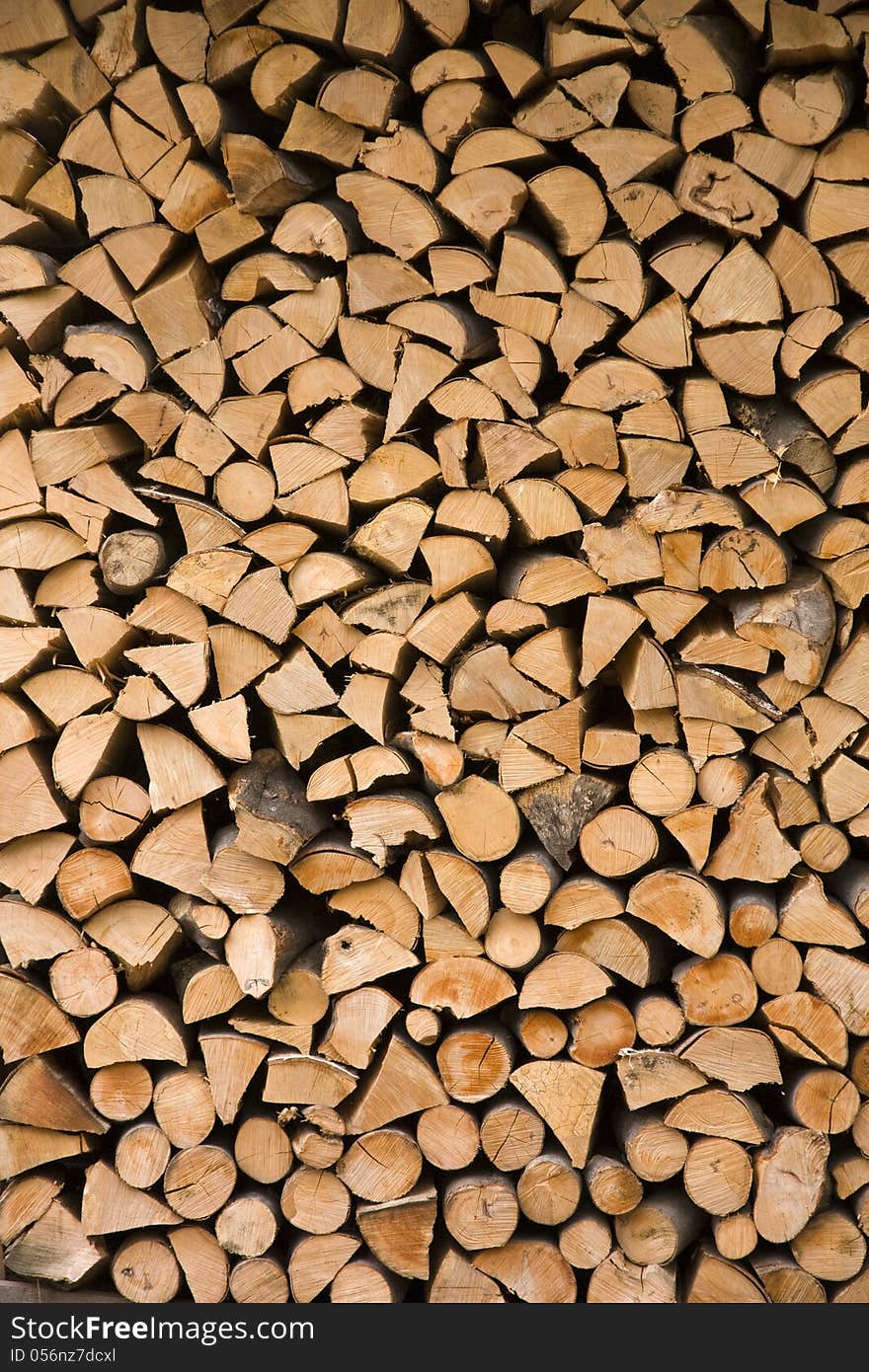 Many small split logs in a pile. Many small split logs in a pile