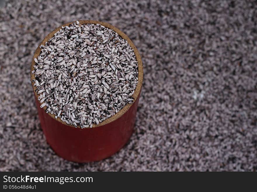 Unpolished rice in a cup for selling at market