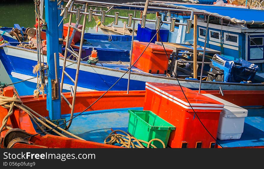 Colorful fishing boat are anchor at the pier