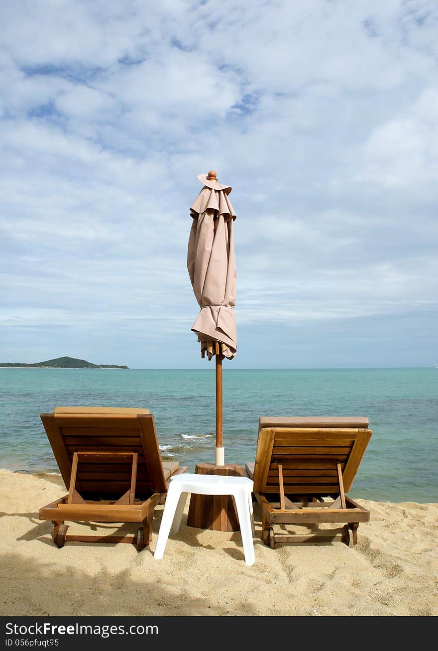 Chairs and umbrella on tropical beach