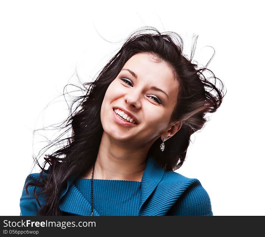 Portrait of a beautiful young woman with hair flying