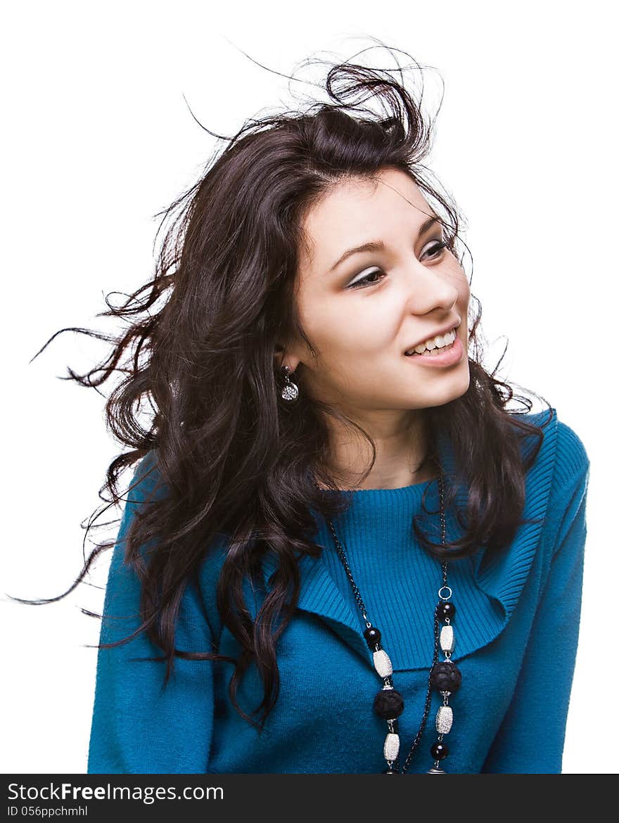 Portrait of a beautiful young woman with hair flying