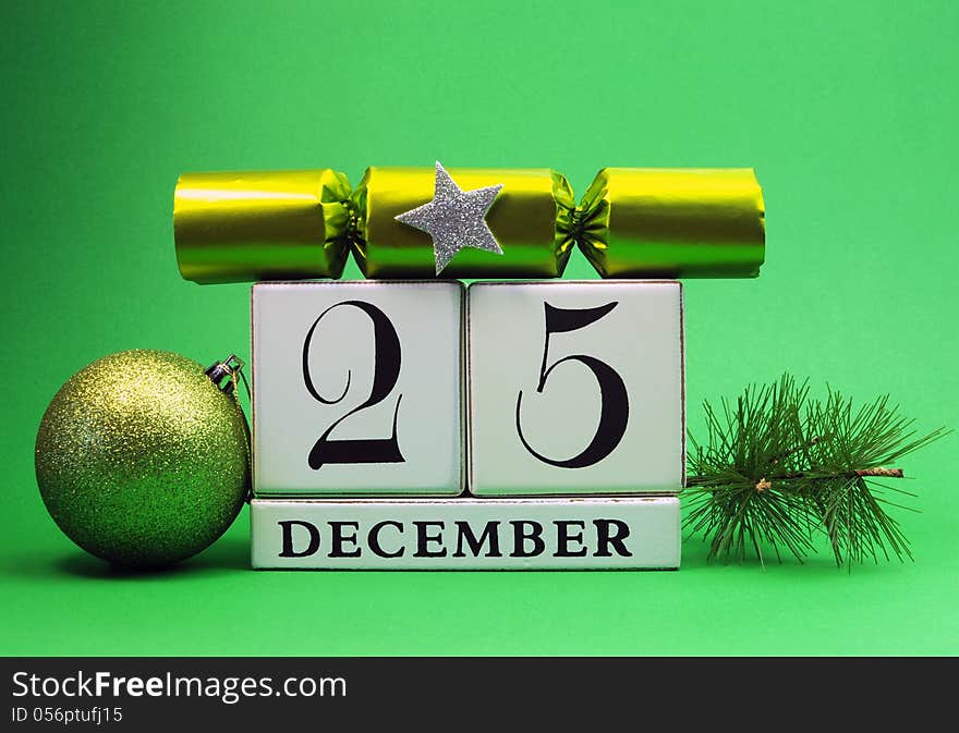 Green theme save the date white calendar for Christmas Day, December 25, with bauble, pine and christmas cracker bon bon. Green theme save the date white calendar for Christmas Day, December 25, with bauble, pine and christmas cracker bon bon.