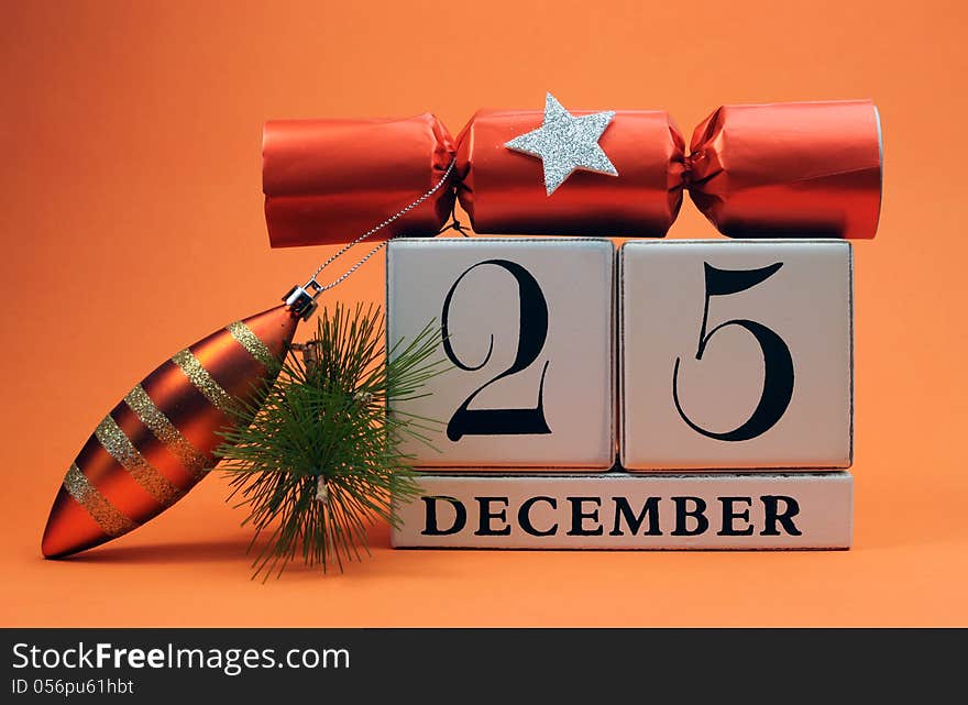 Orange theme save the date white calendar for Christmas Day, December 25, with bauble, pine and christmas cracker bon bon. Orange theme save the date white calendar for Christmas Day, December 25, with bauble, pine and christmas cracker bon bon.