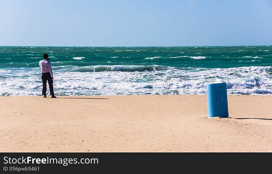 Unidentified individual takes the picture of the sea by the smart phone, on the municipal beach in Dubai, UAE. Unidentified individual takes the picture of the sea by the smart phone, on the municipal beach in Dubai, UAE.