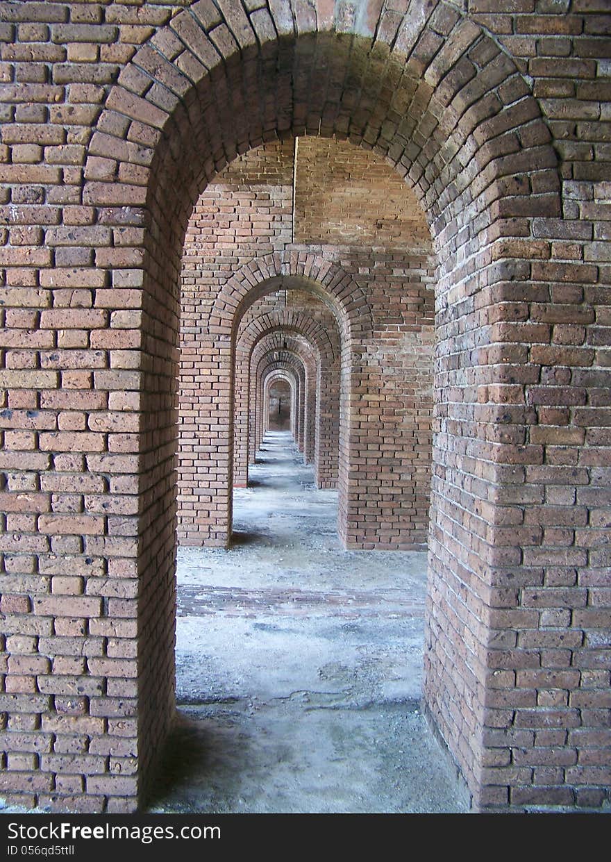 Within fort jefferson at the dry tortugas national park are these walkways full of arches. Within fort jefferson at the dry tortugas national park are these walkways full of arches.
