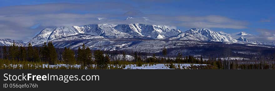 This panorama image shows the Livingston Range of mountains as seen from the North Fork Road in NW Montana not far from the US/Canada border.