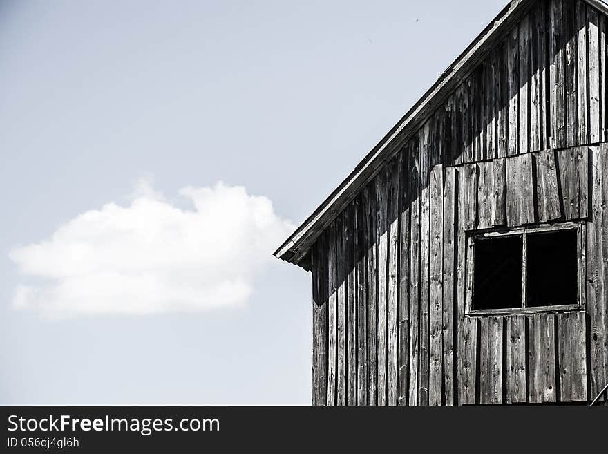 Facade Of The Old Wooden House With Window