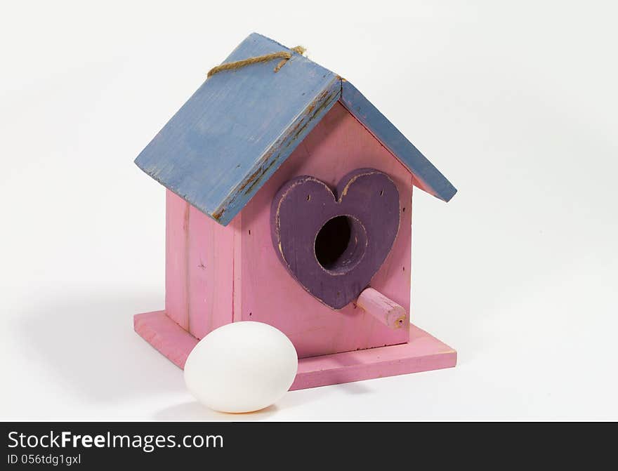 The birdhouse with the egg waiting for the bird. The birdhouse with the egg waiting for the bird.