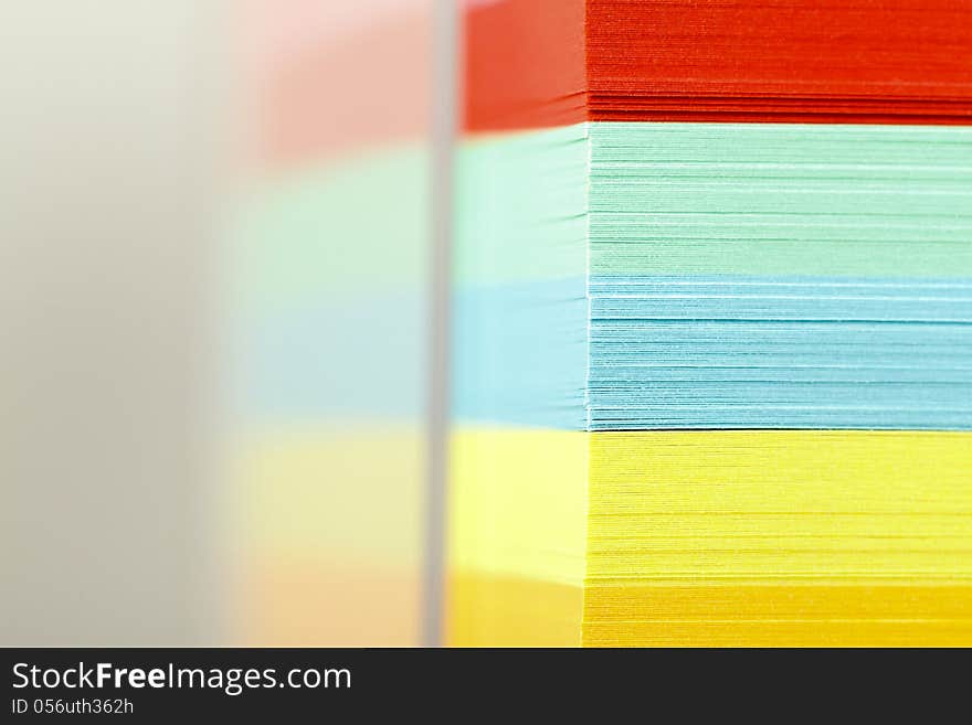 Closeup view of a block of colorful postits. Closeup view of a block of colorful postits.