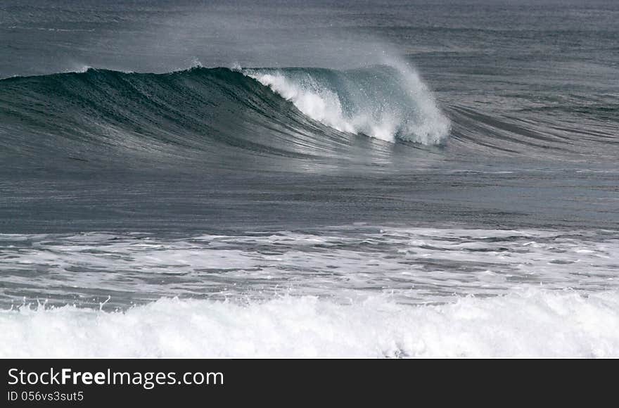 Windblown Foamy Surf Waves At Seashore. Windblown Foamy Surf Waves At Seashore