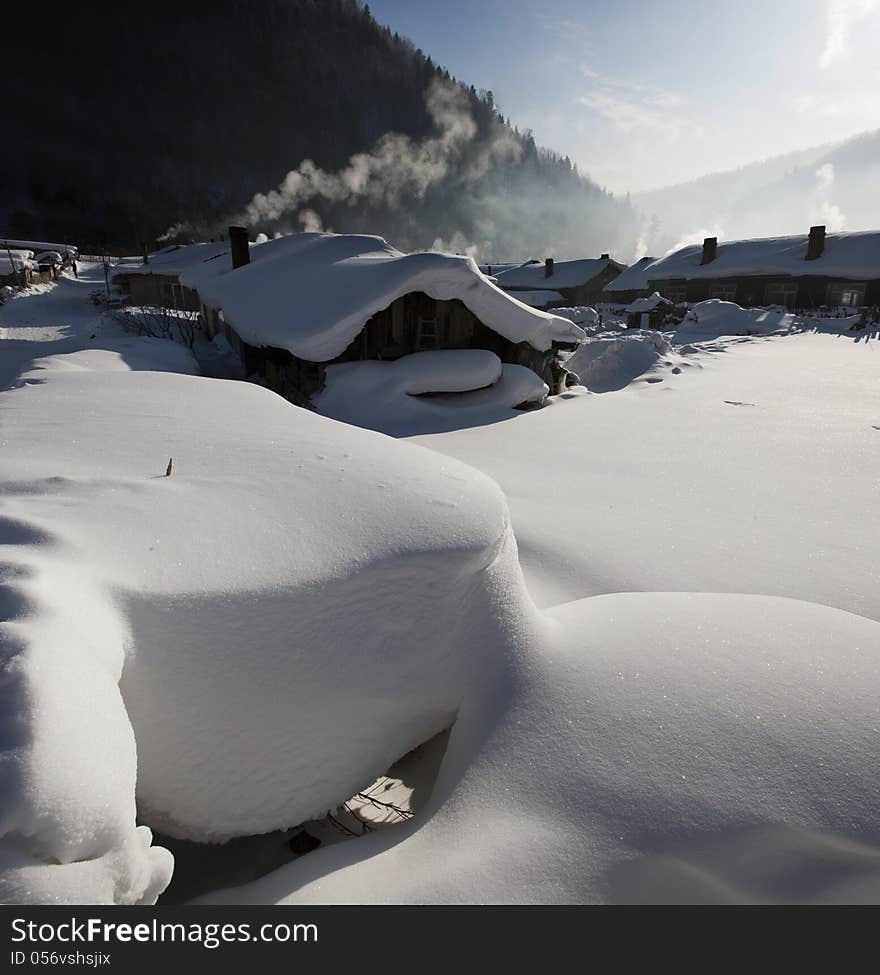 THe Accumulated snow beside the farmhouse in the winter , china. THe Accumulated snow beside the farmhouse in the winter , china.