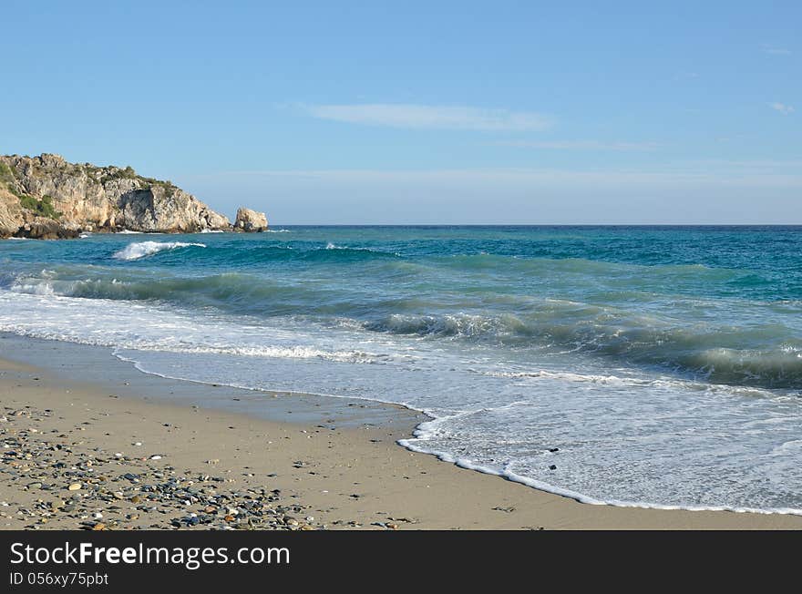 Waves run on the wild sandy beach of the Mediterranean sea. Waves run on the wild sandy beach of the Mediterranean sea.