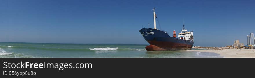 A large cargo ship runs aground off the coast of Ajman, UAE. A large cargo ship runs aground off the coast of Ajman, UAE.