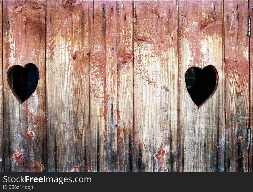 Vintage photo of two hearts in wood