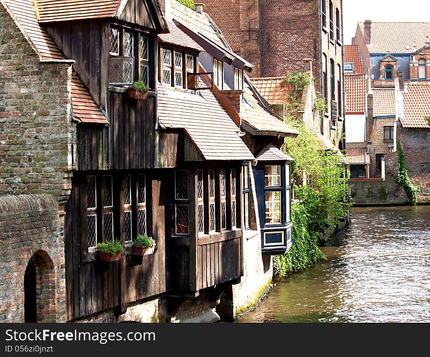 Channels, boat and houses of Bruges. Medieval city.The chocolate city. Urban landscape. Belgium. Europe.