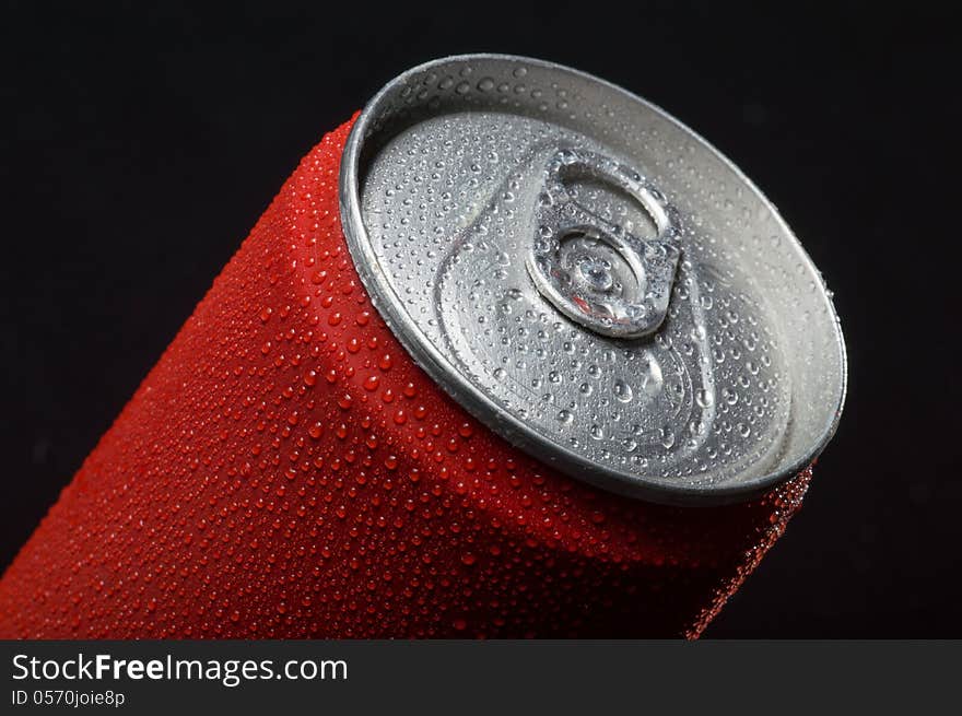 Close-up view of the top of a canned drink with condensation. Close-up view of the top of a canned drink with condensation.