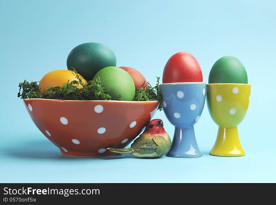 Happy Easter still life with polka dot cups and rainbow color eggs