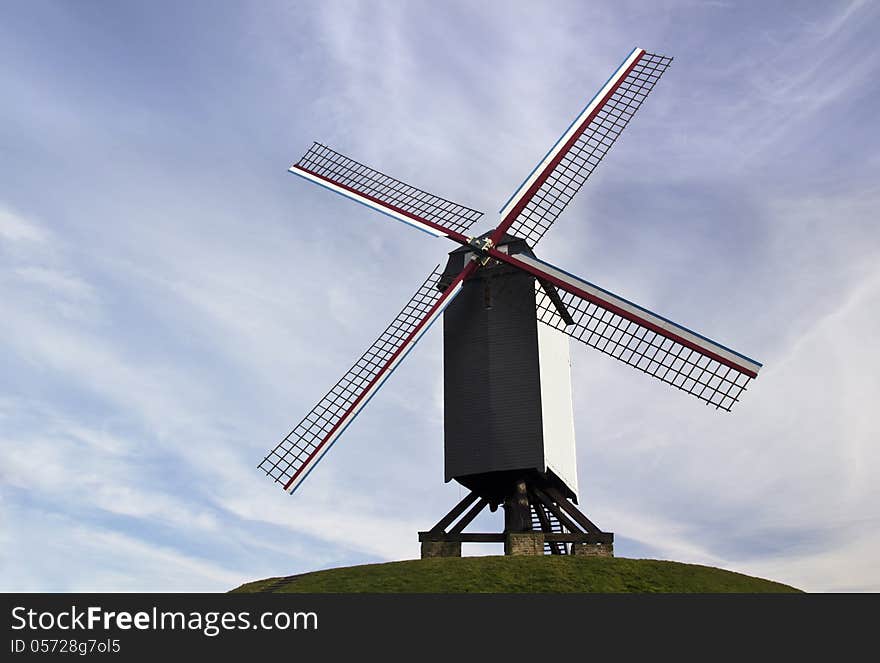 The famous old windmills from Brugge (Bruges) in Flanders Belgium, with a beautiful blue sky in the background. The famous old windmills from Brugge (Bruges) in Flanders Belgium, with a beautiful blue sky in the background.