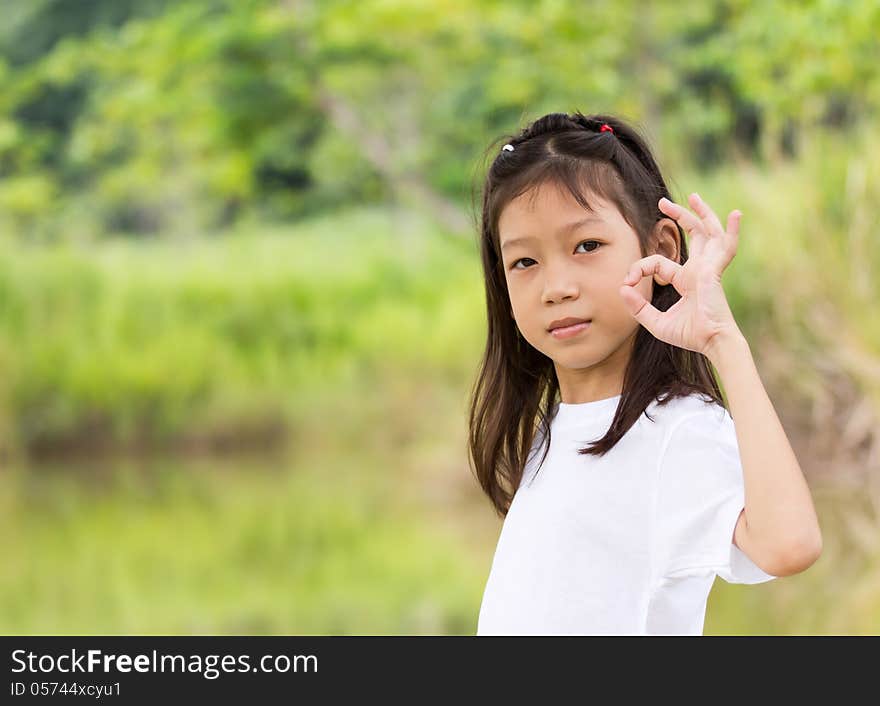 Outdoors portrait of beautiful Asian young girl. Outdoors portrait of beautiful Asian young girl
