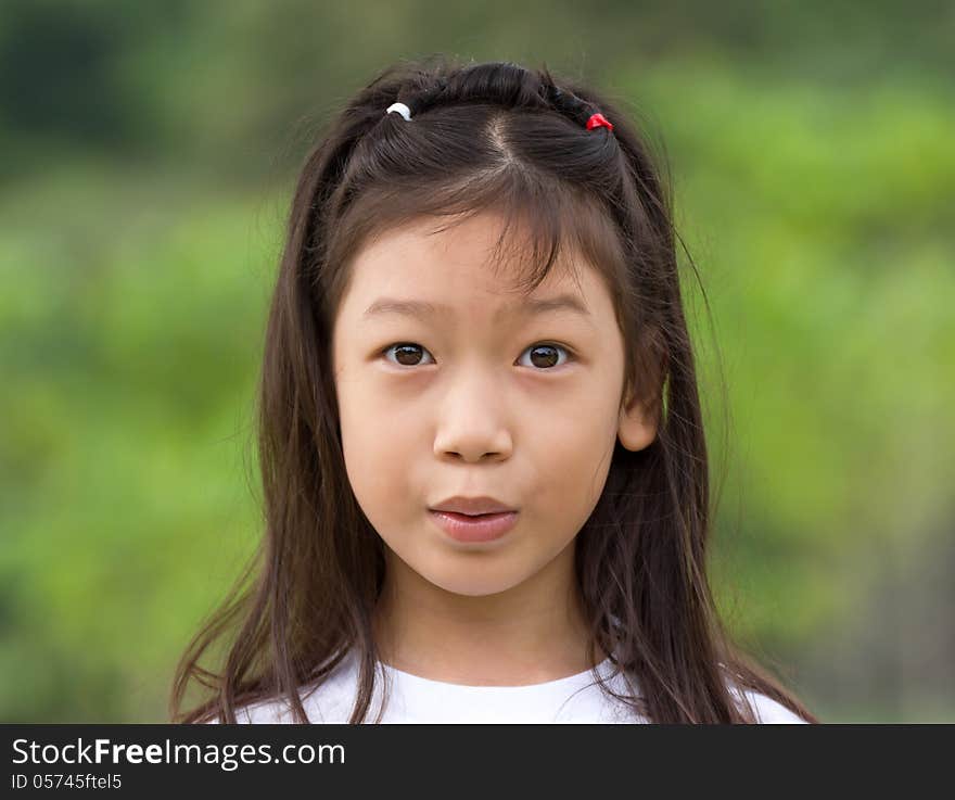 Outdoors portrait of beautiful Asian young girl. Outdoors portrait of beautiful Asian young girl