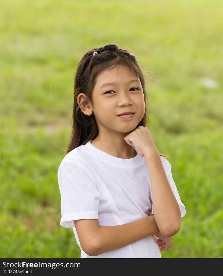 Outdoors portrait of beautiful Asian young girl. Outdoors portrait of beautiful Asian young girl