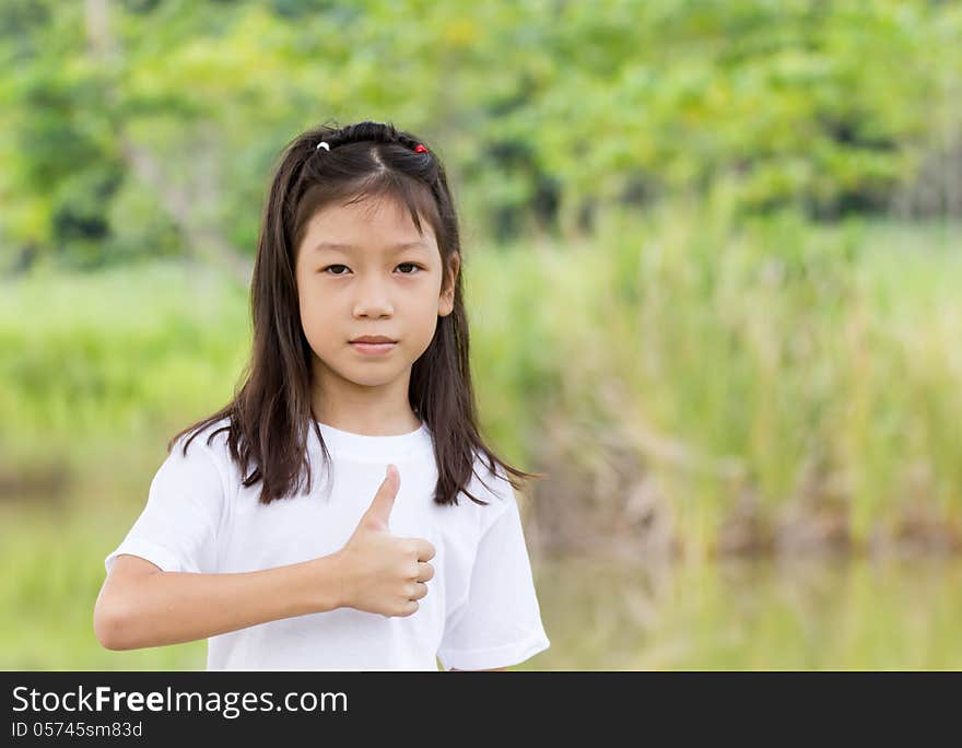 Outdoors portrait of beautiful Asian young girl. Outdoors portrait of beautiful Asian young girl