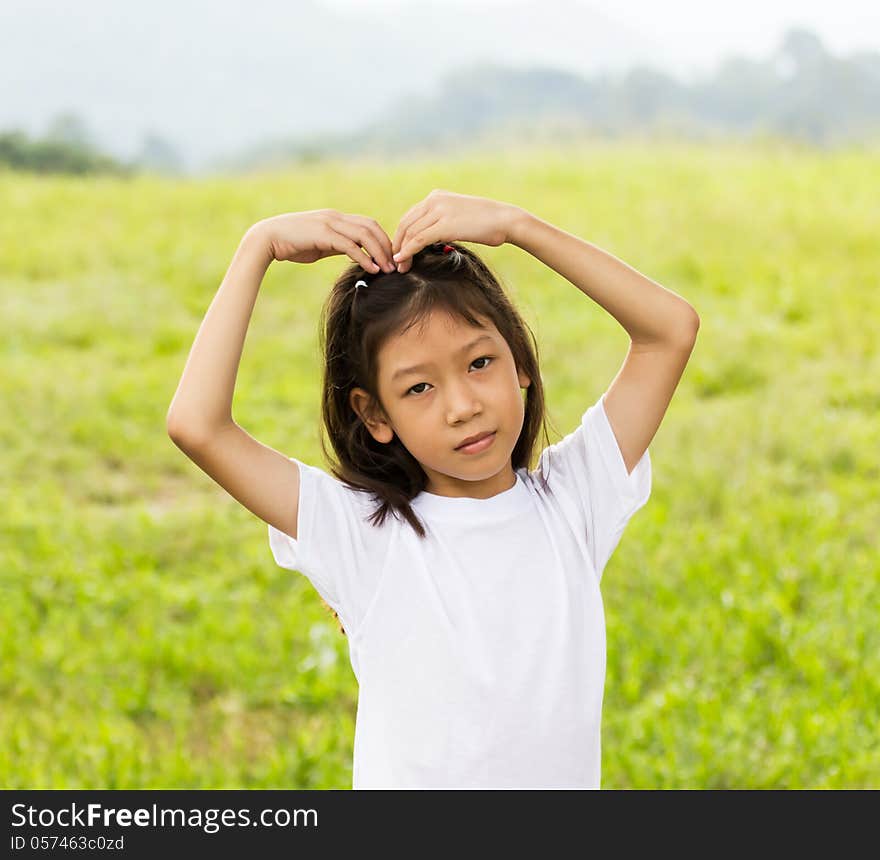 Outdoors portrait of beautiful Asian young girl. Outdoors portrait of beautiful Asian young girl