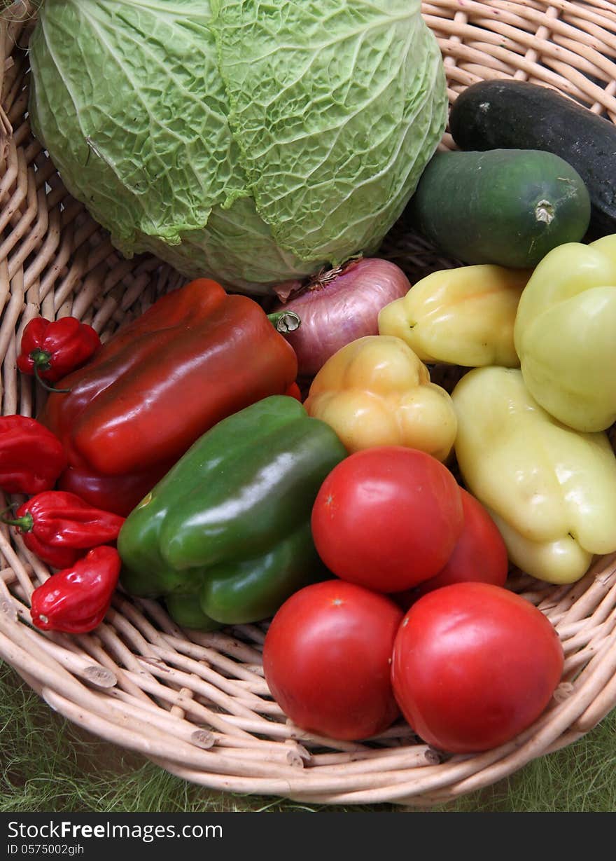 Some fresh vegetables fruit from home garden in to the basket made from organic material