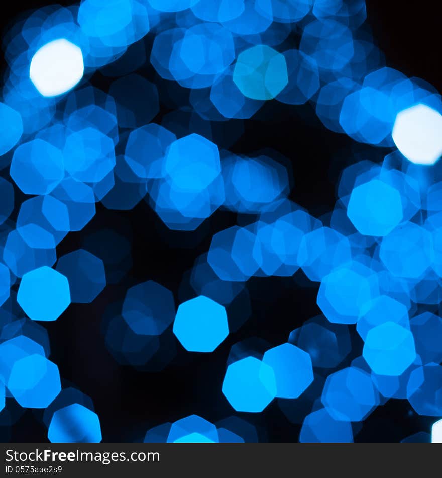 Defocused abstract blue new year lights background. Defocused abstract blue new year lights background