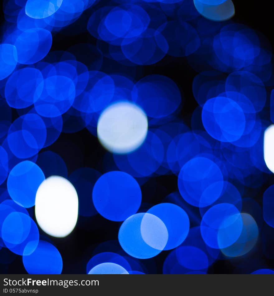 Defocused abstract blue new year lights background. Defocused abstract blue new year lights background