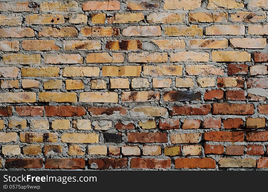 Aged brick wall background. High resolution texture