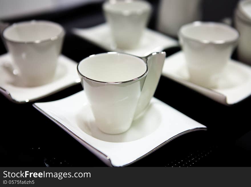 White ceramic cups on table