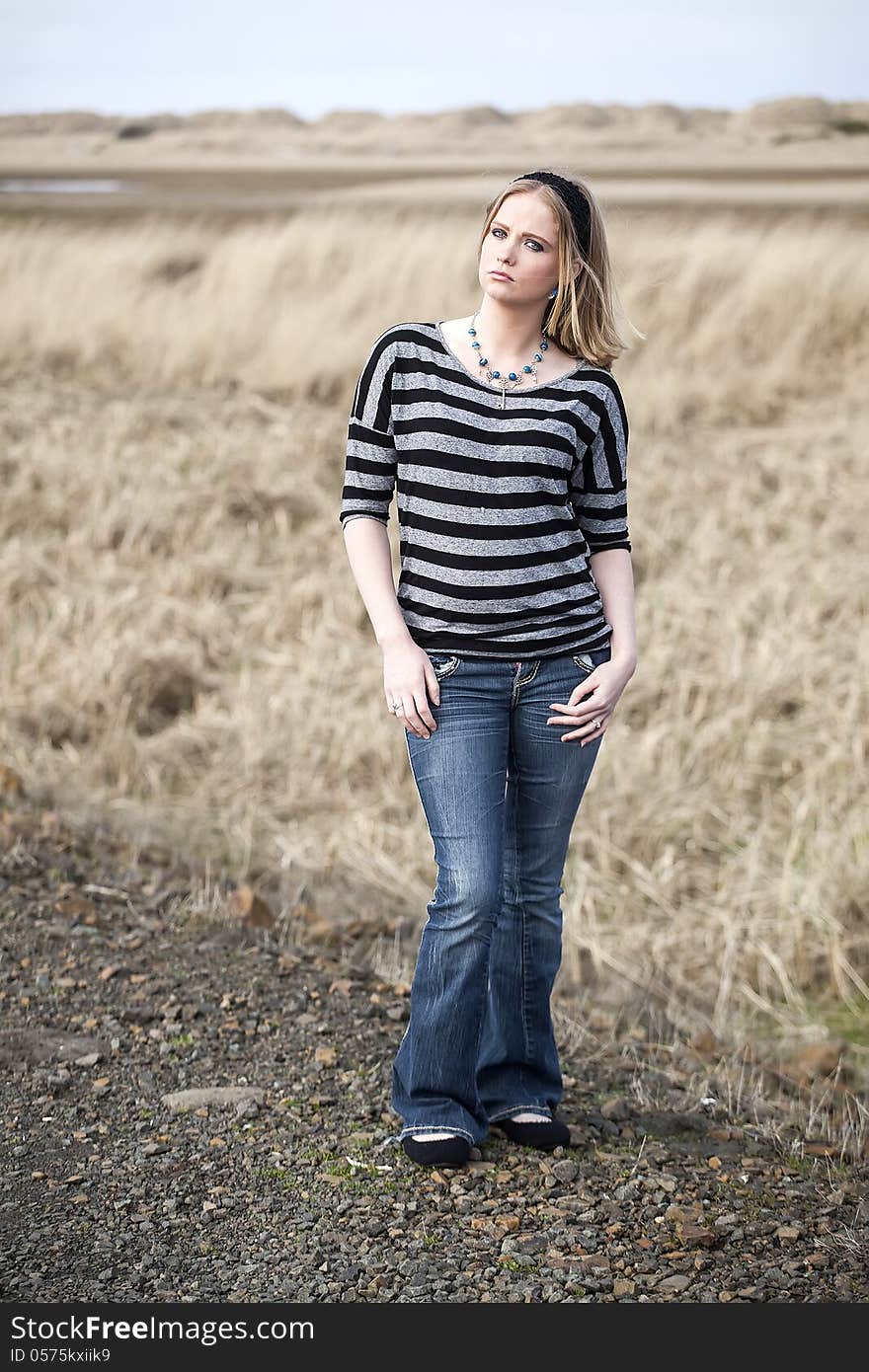 Portrait of a young woman staring straight ahead into the camera. Portrait of a young woman staring straight ahead into the camera