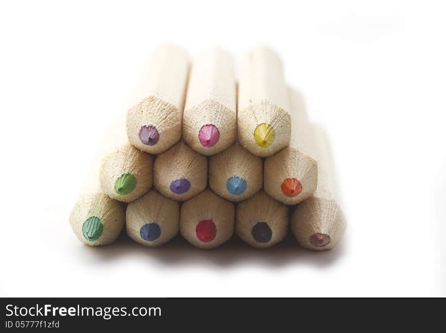 Macro shot of multicolour wooden ecology crayon isolated on white. Macro shot of multicolour wooden ecology crayon isolated on white