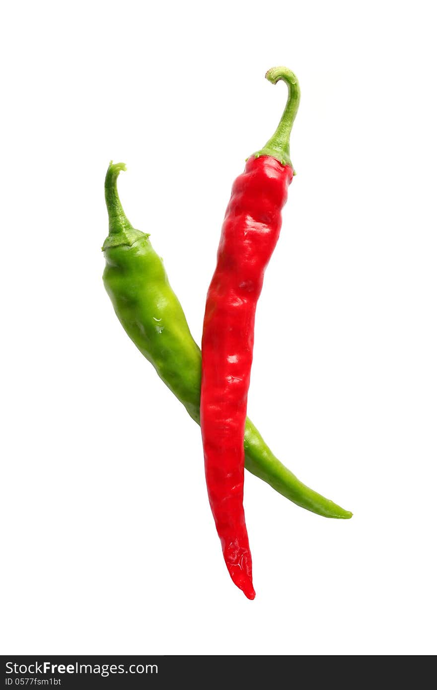 Ripe, red and green chilis isolated on a white background.