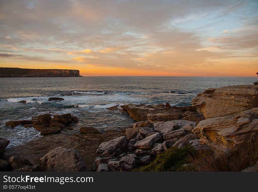 Sunset and rock beach