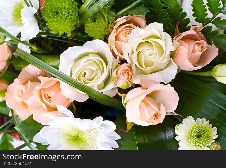 Bouquet of roses and chrysanthemums in composition, closeup