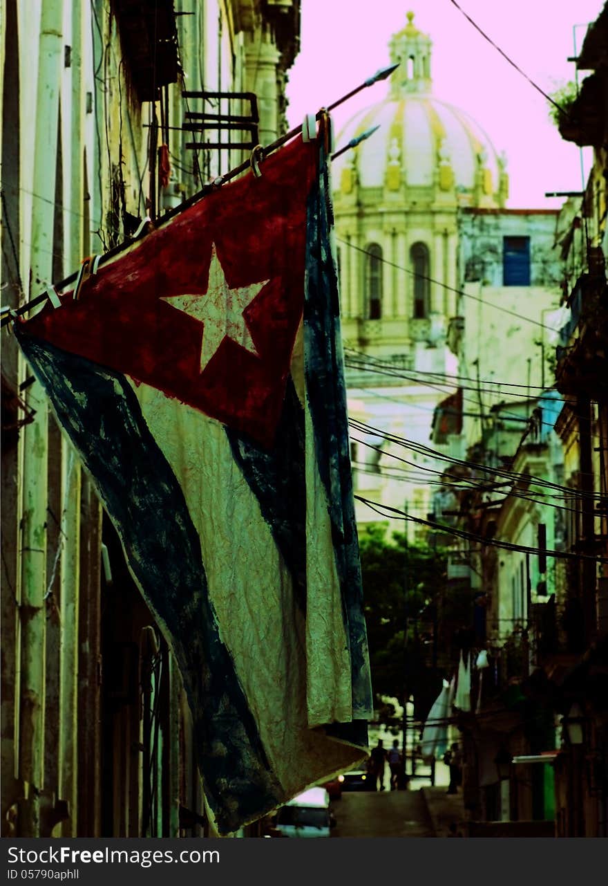 Typical old Havana street with a vintage flag, Cuba.