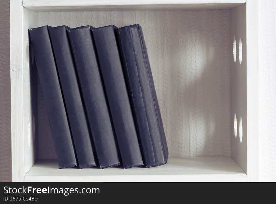 Five books similar black books on white bookshelf