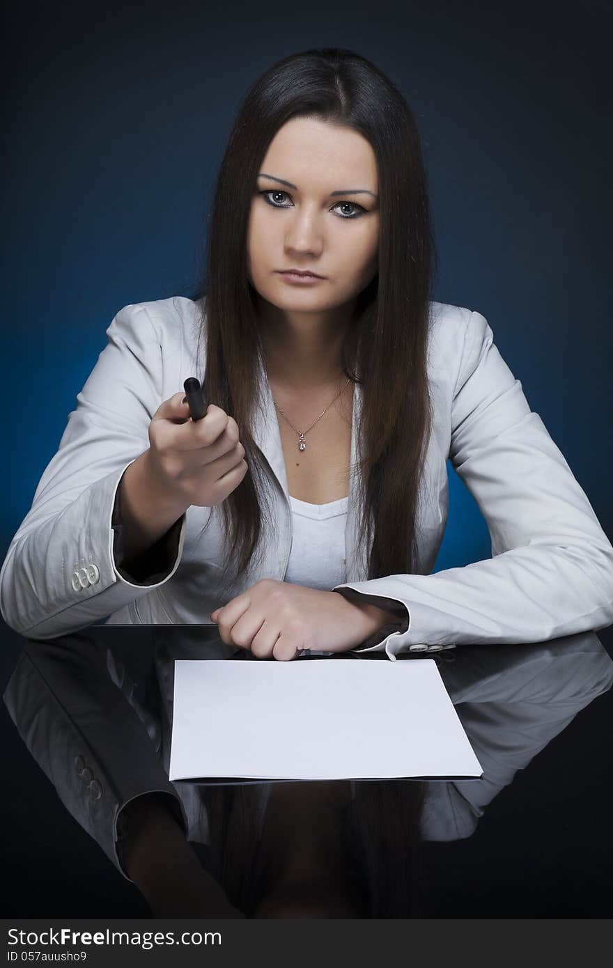 A business woman at a meeting table. A business woman at a meeting table.