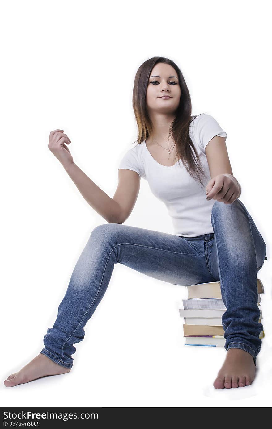 Confident Student Woman Sitting On The Books