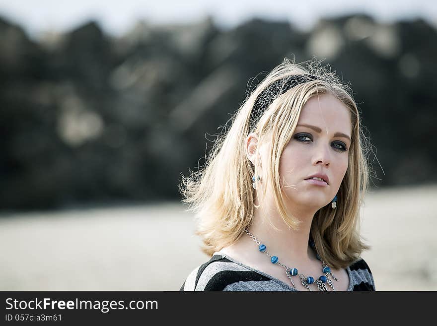 Portrait of a young woman at the beach. Portrait of a young woman at the beach.