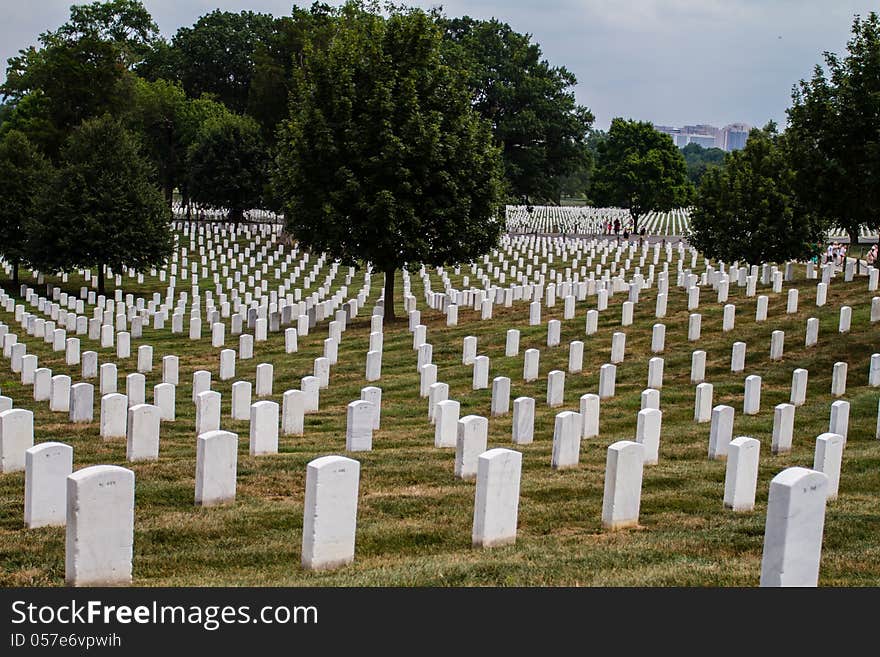 Rows and rows of white grave markers at Arlington Cemetery, Washington, DC. Rows and rows of white grave markers at Arlington Cemetery, Washington, DC