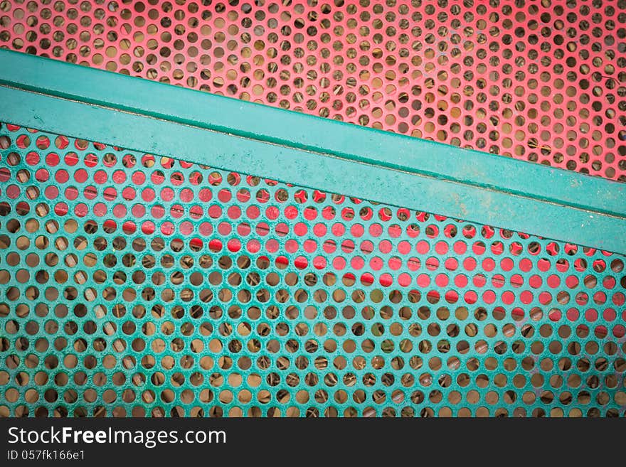 Green And Red Metal Sieve