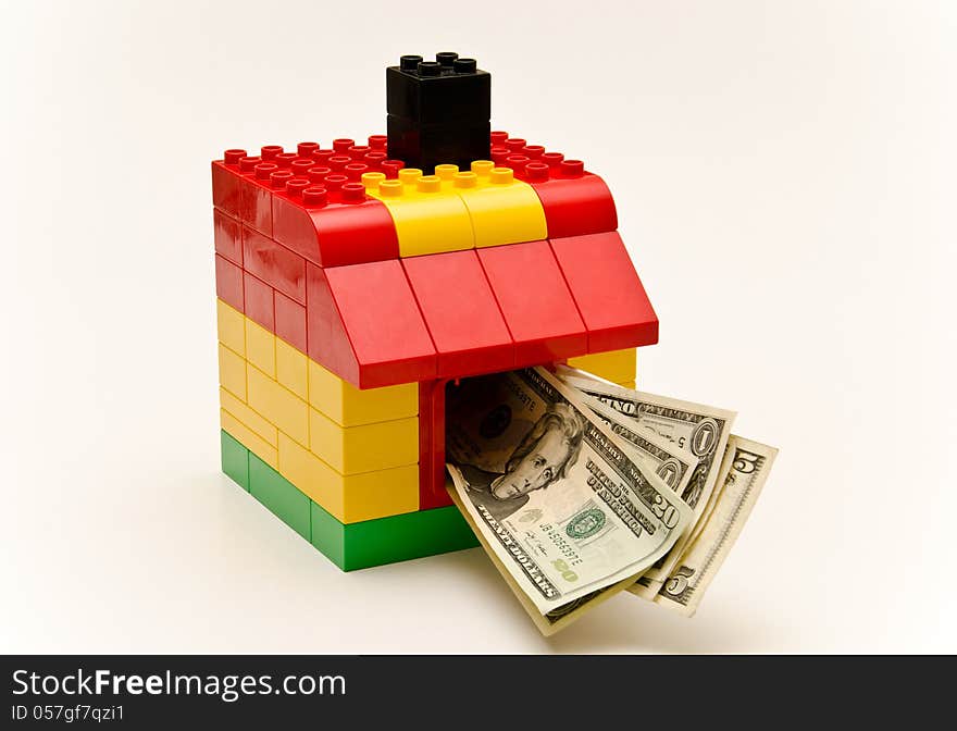 LEGO house and money. Dollars out of the window.