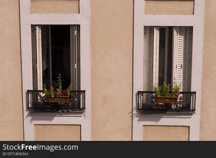 Typical french windows in building in Paris, France