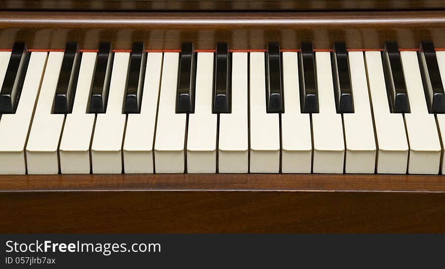 Closeup of Piano Keys on 60's instrument.