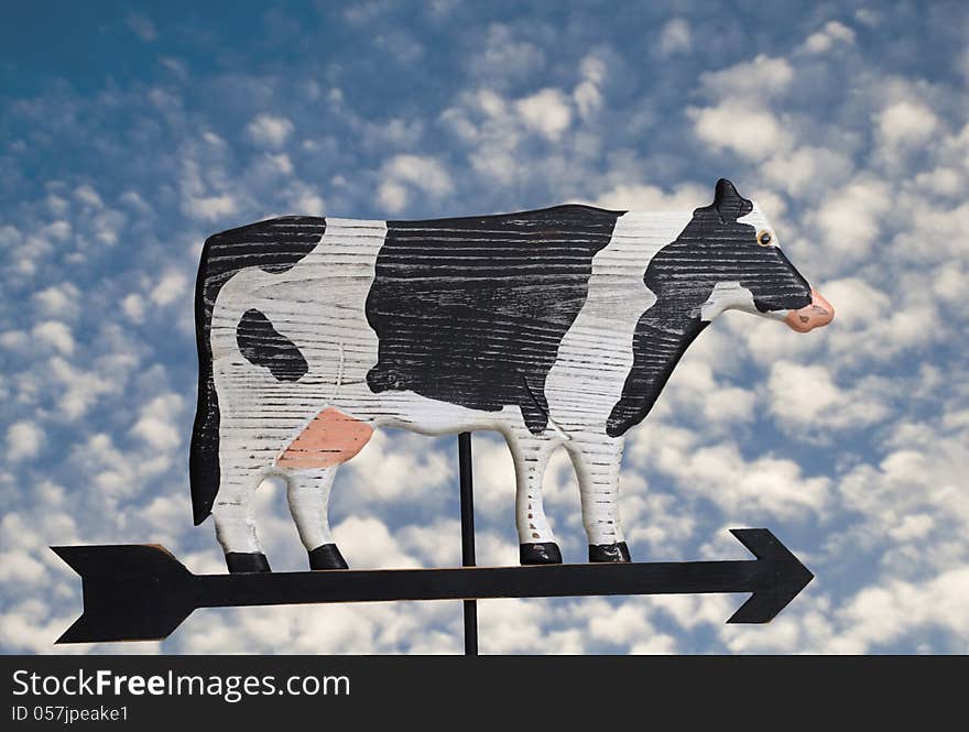 Wooden hand crafted cow weather vane.