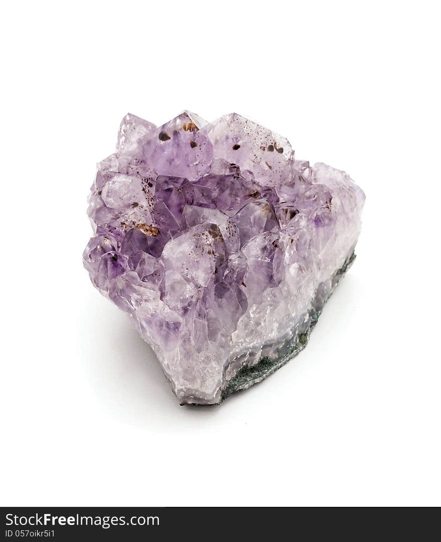 Amethyst stone on a white background .